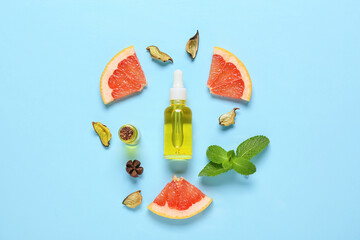 Composition with bottle of essential oil, grapefruit and mint on color background