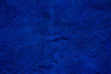 Blue colored abstract wall background with textures of different shades of blue