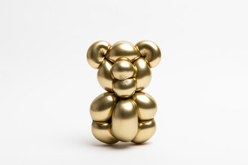 A cute little bear made from a 260 magic balloon with a Reflex gold color on a white background.