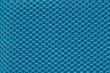 Full frame blue hexagon mesh pattern background.