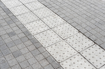 Tactile sidewalk concrete tile outside