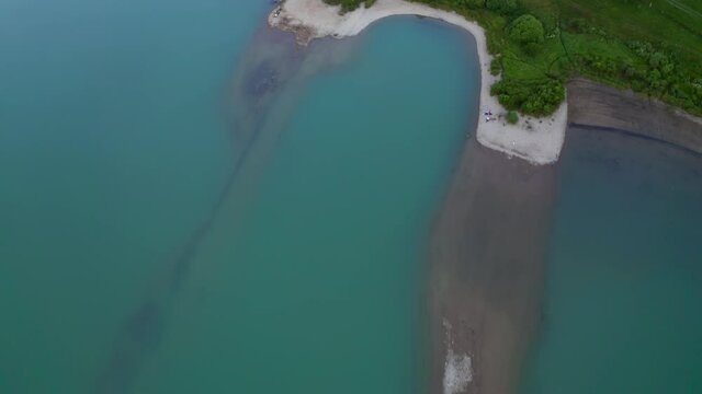Drone Flight Over Turquoise Water Of Barajul Frumoasa, Rock Dam Built On The Frumoasa River In Harghita County, Romania. aerial