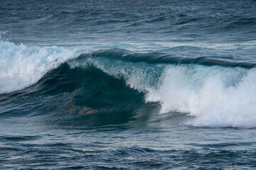 big wave breaking on the shore at the beach