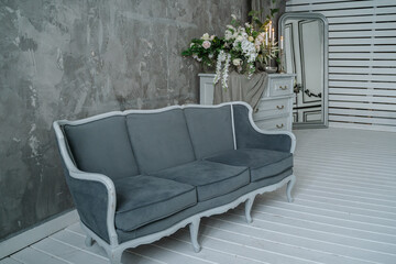 Grey sofa close-up in the home interior