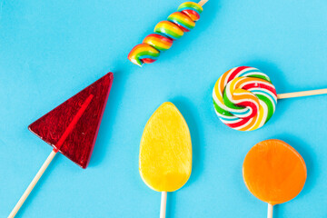 Colorful candies, lollypop on the blue color background