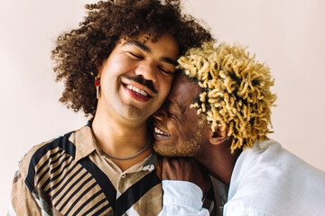 Affectionate young gay couple embracing each other - obrazy, fototapety, plakaty