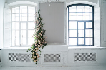 Decoration of the wall with artificial flowers peonies