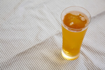 Cold Beer in a Glass, side view. Space for text.
