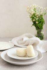 Plates with tasty Japanese mochi on table