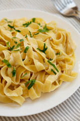 Homemade One Pot Garlic Parmesan Pasta with Parsley, side view.