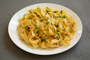 Homemade One Pot Garlic Parmesan Pasta with Parsley, low angle view. Close-up.