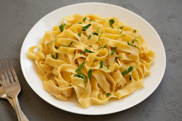 Homemade One Pot Garlic Parmesan Pasta with Parsley, side view. Close-up.