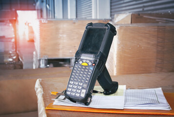 Bar Code Scanner and Clipboard on Package Boxes in The Storage Warehouse. Computer Work Tools for...