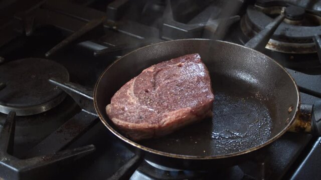 Medium view of cooking a Rump steak.