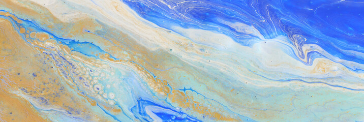 art photography of abstract marbleized effect background. Blue, mint and gold creative colors. Beautiful paint.