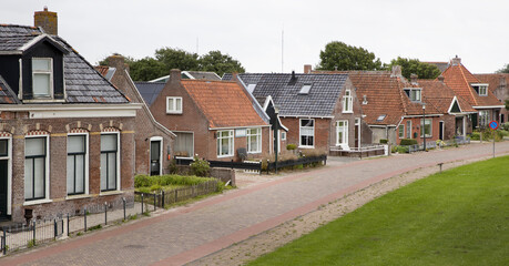Fototapeta na wymiar Waddenzee coast Moddergat Paesens Friesland Netherlands. Unesco world heritage. Village and historic fishermen houses.