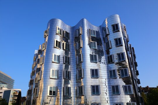 DUSSELDORF, GERMANY - SEPTEMBER 19, 2020: Neuer Zollhof modern architecture in Dusseldorf, Germany. The residential complex was designed by American architect Frank Gehry in 1998.