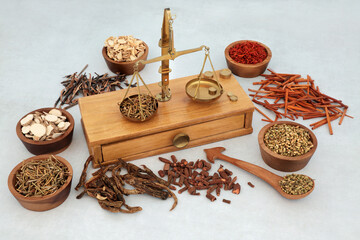 Traditional Chinese herbs and spice used in herbal plant medicine with apothecary old weighing...