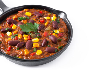 Traditional mexican tex mex chili con carne in iron pan isolated on white background