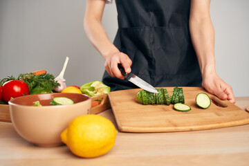 cooking salad with fresh vegetables slicing in the kitchen