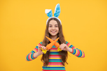 cheerful bunny kid with carrot. happy easter holiday. funny child hold carrot. teenager girl rabbit