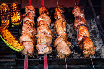 Grilled meat and vegetables. Grilling meat with the addition vegetables. Cclose-up. Grilling food,...