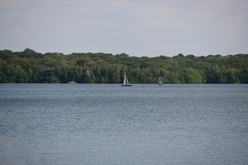Fototapeta na wymiar sailing boat on a beautiful lake on a sunny summerday in belgium