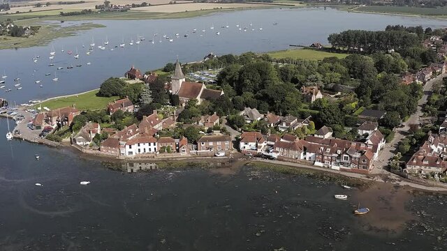 Aerial Footage along the waterfront of Bosham Village an historic English Village which is a popular holiday destination.