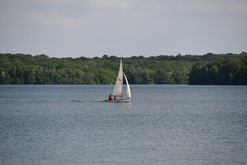 sailing boat on a beautiful lake on a sunny summerday in belgium