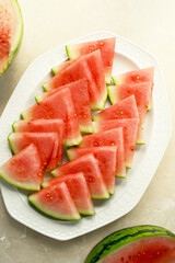Seedless watermelon slices on a plate. Delicious summer foods, healthy snack.