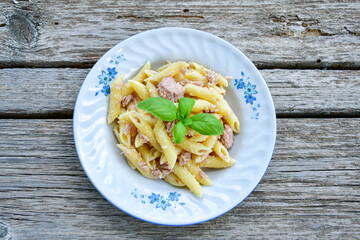  Italian home made   penne  pasta  with  lemon  tuna  fish, parmesan cheese and black pepper .