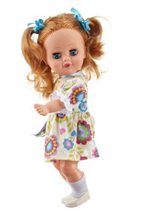 Realistic silicone doll of a teenage girl standing sideways to the viewer in a light dress, with long blonde hair gathered in ponytails, isolated on a white background.