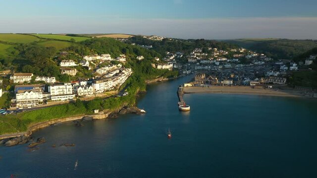 4K: Aerial Drone Video of Looe in Cornwall, England, UK. Approach shot towards the Banjo Pier. Stock Video Clip Footage