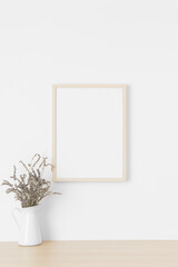 Wooden frame mockup on the wall with a lavender.