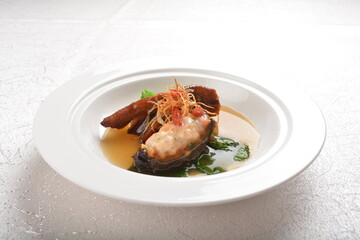 braised sea cucumber with minced meat and chicken claw feet meat in thick oyster sauce asian halal menu