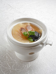 double boiled luxury seafood shark's fin crab meat and mushroom thick soup in hot clay pot asian premium halal menu