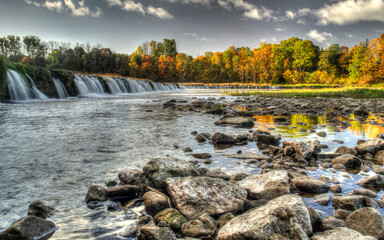 Venta waterfall and stones in autumn day. The widest waterfall in Europe, Kuldiga, Latvia.