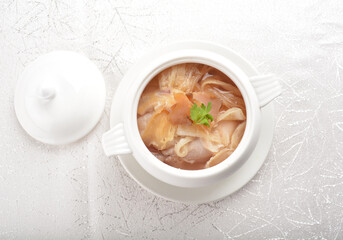 double boiled luxury seafood shark's fin crab meat and mushroom thick soup in hot clay pot asian premium halal menu