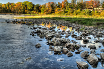View of the Venta River on a sunny autumn day, Kuldiga, Latvia.