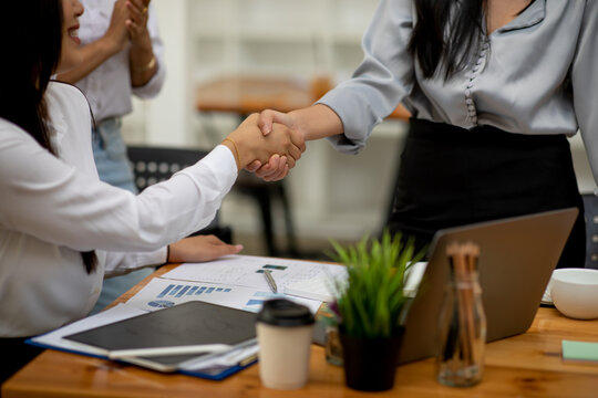 Business woman partnership handshake concept.Photo two coworkers handshaking process.Successful deal after great meeting.