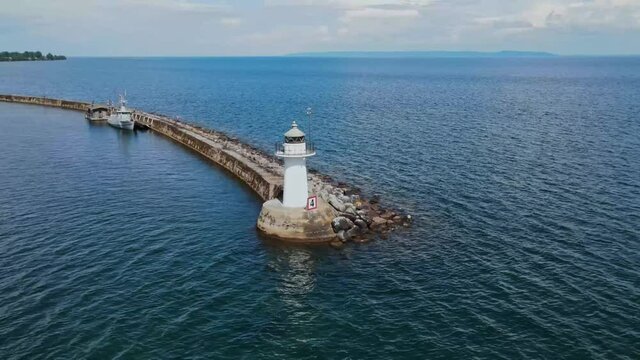 Southern Lighthouse At The Seawall In Hjo Harbour On The West Coast Of V&auml;ttern, Sweden. aerial