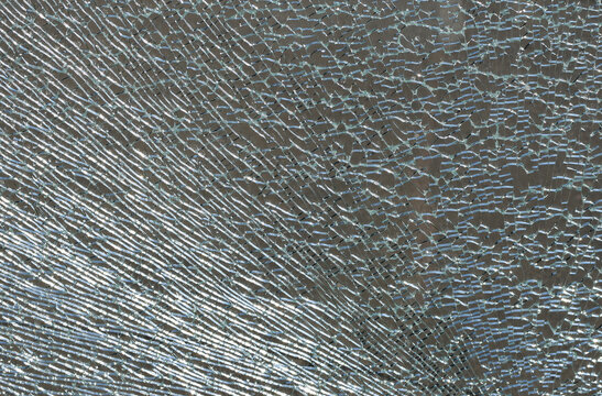 broken glass texture, background. Broken glass on the light, texture background