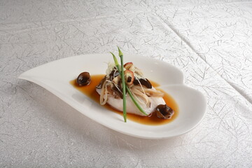 steam cook cod fish seafood fillet with herb, fungus and soy sauce asian premium halal menu