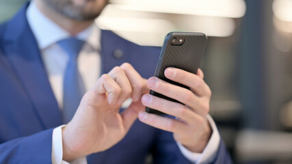 Close up of Hands of Businessman using Smartphone