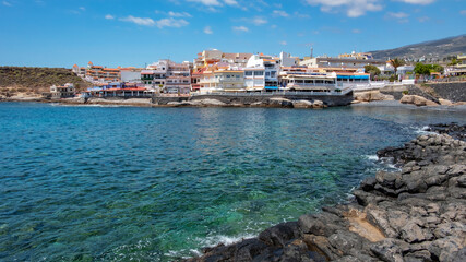 Naklejka na ściany i meble La Caleta, a resort on the western coast of the island with beautiful traditional architecture, local fish restaurants and tranquil atmosphere, Costa Adeje, Tenerife, Canary Islands, Spain