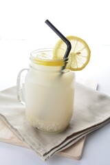 cold iced lemon barley juice with lemon in glass jar white background asian beverage halal menu