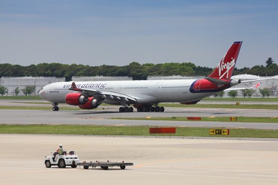 TOKYO, JAPAN - MAY 12, 2012: Virgin Atlantic Airbus A340 at Narita International Airport, Tokyo. Narita Airport is one of top 3 busiest airports in Japan.