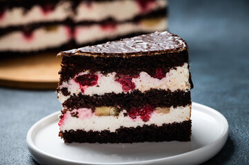 Chocolate cake with raspberry on plate. Slice of cake. Raspberry cake. Wedding dessert. Black forest cake. Delicious dessert. Traditional german dessert