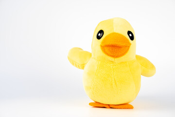 Yellow plush duck toy isolated on white.