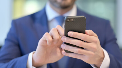Hands of Middle Aged Businessman using Smartphone, Close up